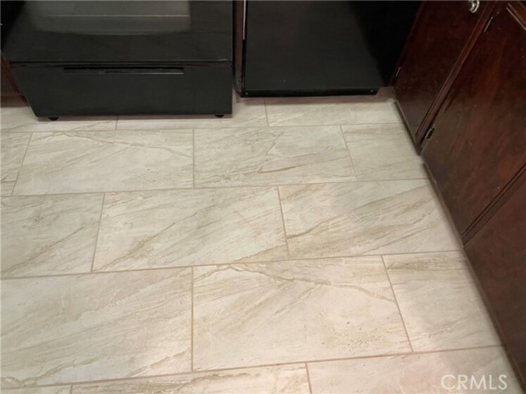 Tile floor in kitchen installed 3/22/2021