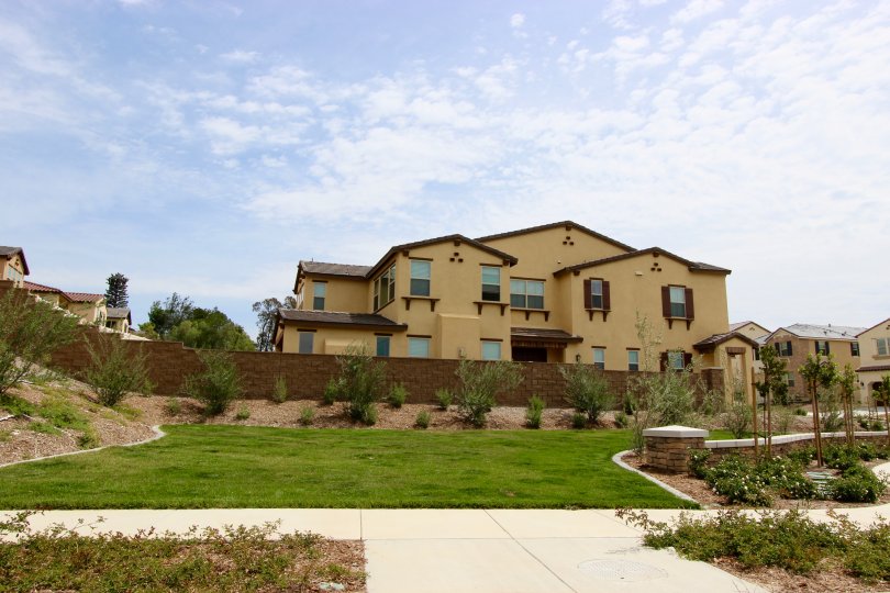 A grassy greenbelt park area at The Vineyard by Van Daele