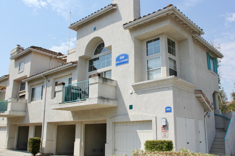 A blue sign states the number of a townhouse in the Villagio complex.