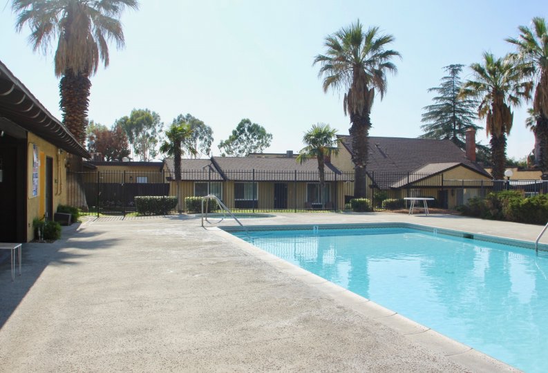 A sunny day featuring the pool at Pepper Tree Villas in Hemet California
