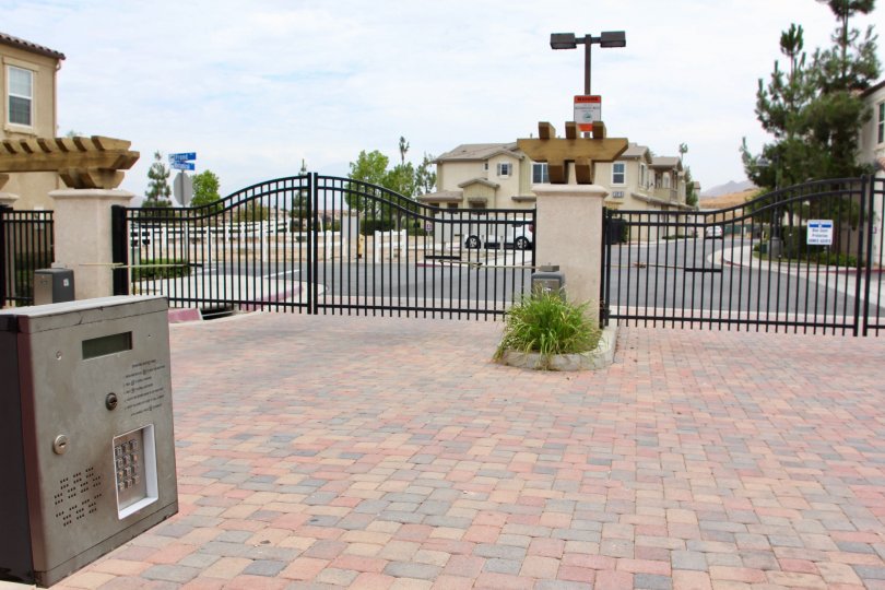 The exterior of a gated community on a sunny day in Moreno Valley, California.