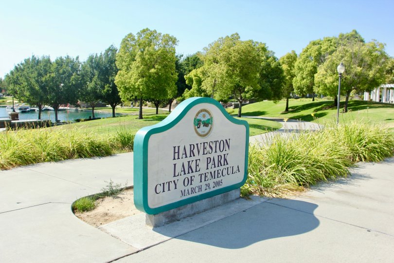 Park sign at Harveston Lake Park where public area is maintained and gardens kept pleasant for locals