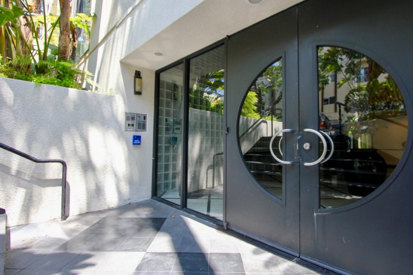 big and attractive gate of glass on entry of building in California