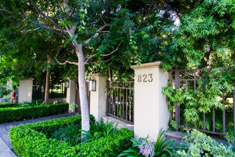 The Brentwood Garden Villas address number are mounted to a pillar