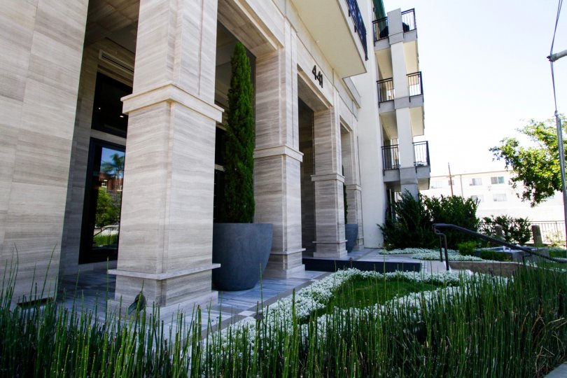 Beautifully landscaped planters cover the entrance to Cosmopolitan Brentwood