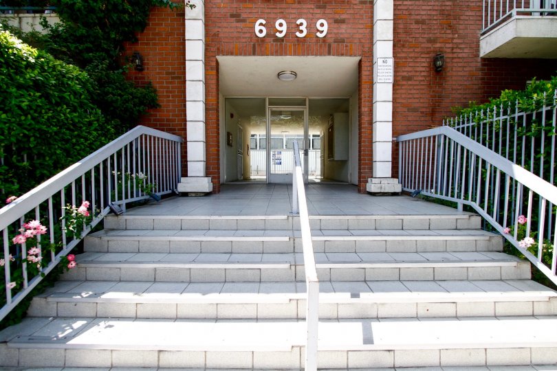 The address of Woodland Court above the entrance