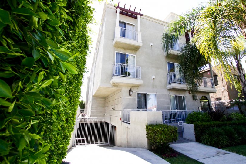 The entry to Hollywood Gate Homes offers private parking and a walkway to the front entry