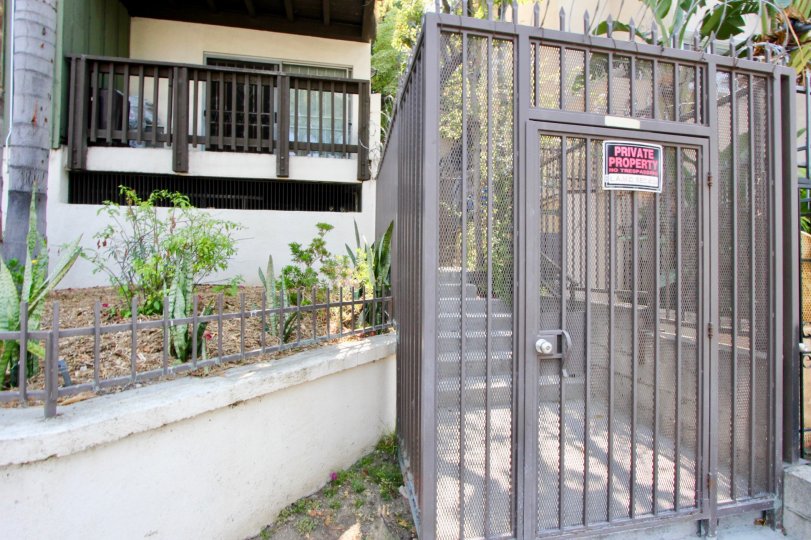 A garden and gated area of an apartment at Garden Villas