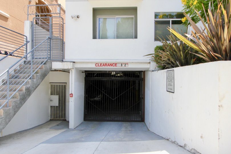 Entrance to Regency Villas showing the parking and stairway, Koreatown, California