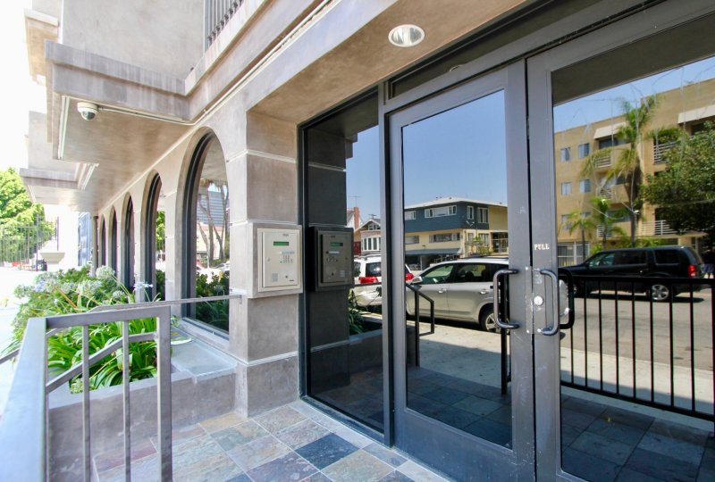 The entrance doors of The Juniper in Koreatown California