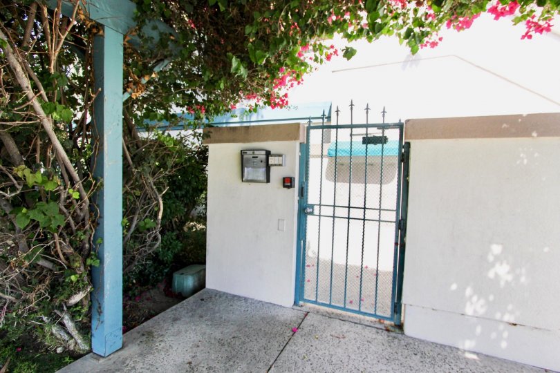 The gate into 4751 E Pacific Coast Hwy in Long Beach, California