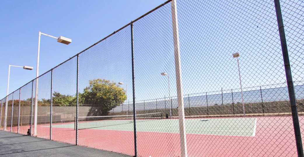 The fence around the courts at El Dorado Lakes