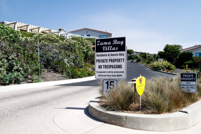 The sign into Zuma Bay Villas in CA California