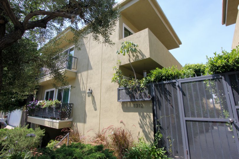 A two-storey housing in Berkeley Street community with grayish blue gates.