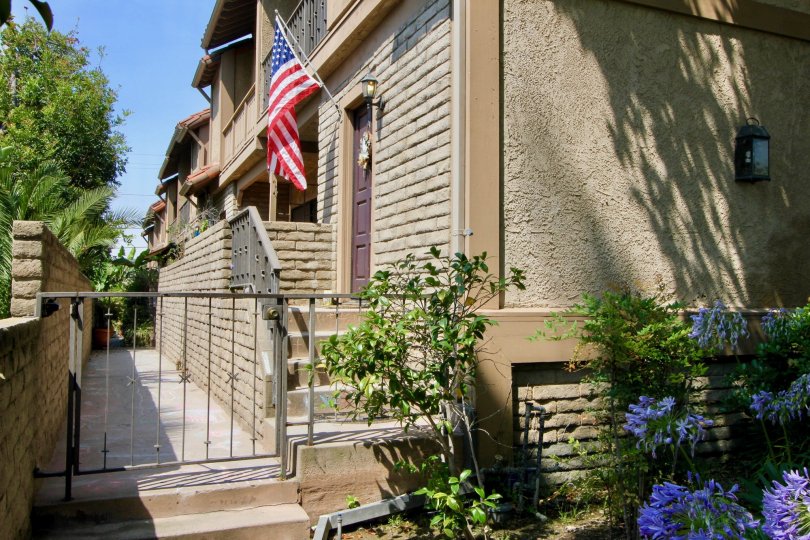 Gated entrance with an american flag at a Berkeley Townhome