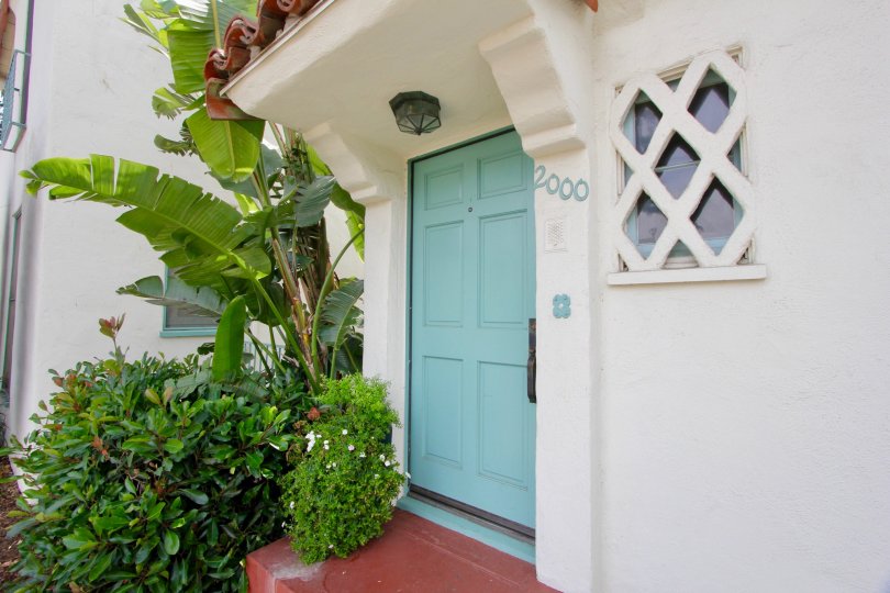 Big white home in santa monica with large light blue gate
