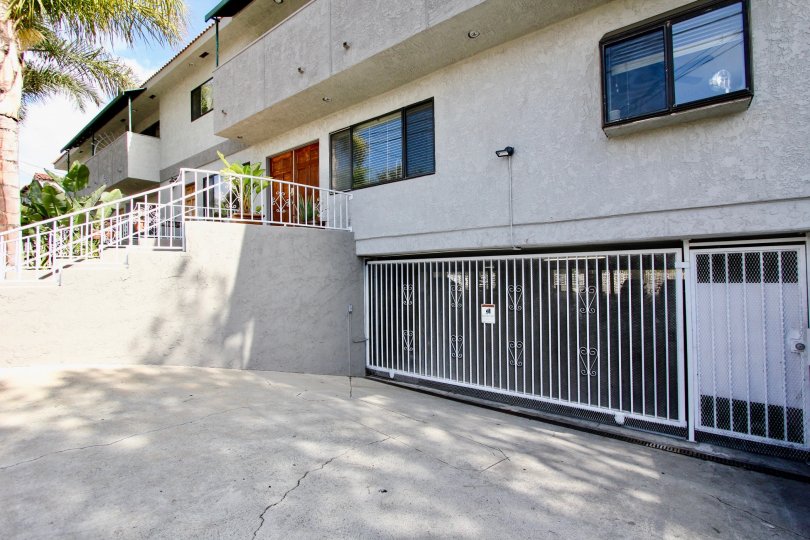 The gate into the parking area for Lucile Townhomes