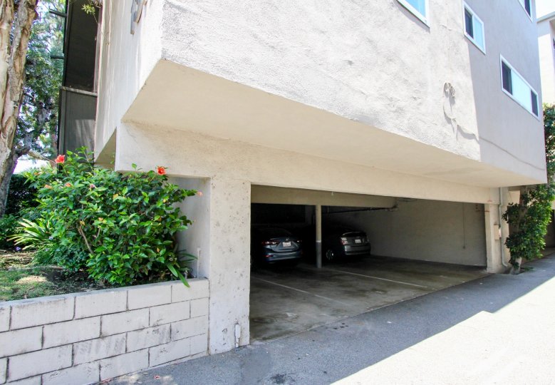 the garage of a building in 1312 Centinela with plants at the side