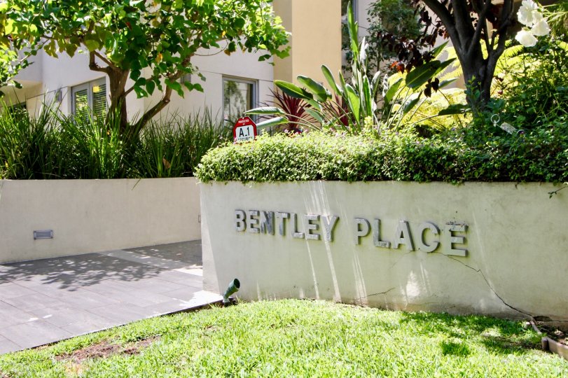 Entrance and welcome signage to Bentley Plaza Apartments, West La, California