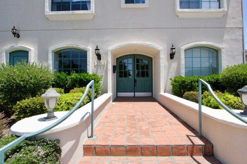 A sunny image of the front door of the Colby Regency in West LA, California