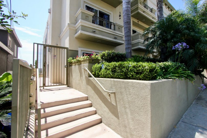 The Rochester, in West LA, California, shows balconies overlooking mature landscaping.