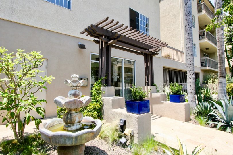 Beautiful arbor and fountains greet you at the entranceway to 2263 Fox Hills in Westwood California.