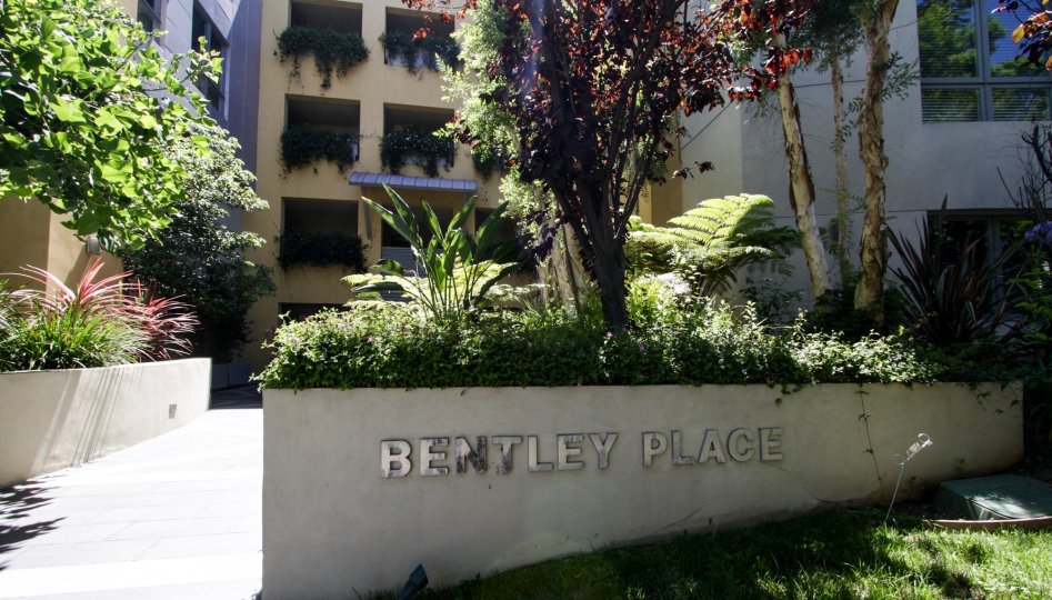 The name of Bentley Place in the front of the complex