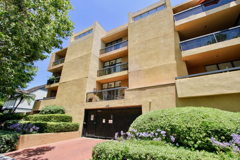 The Walden Condos, a lovely moden building with multi levels and a garden lined walkway.