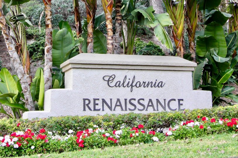 Beautiful banana trees and flower garden with signboard in California Renaissance of Aliso Viejo