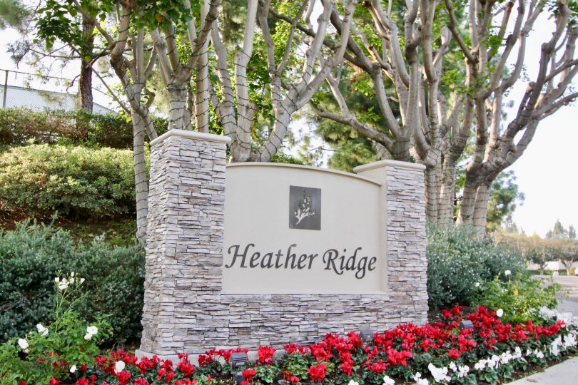Awesome flower garden with trees near signboard in Heather Ridge of Aliso Viejo