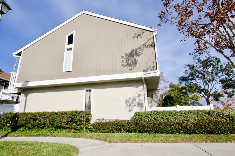 Side view of a grey house with white trim in the Morningside community of Aliso Viejo, California