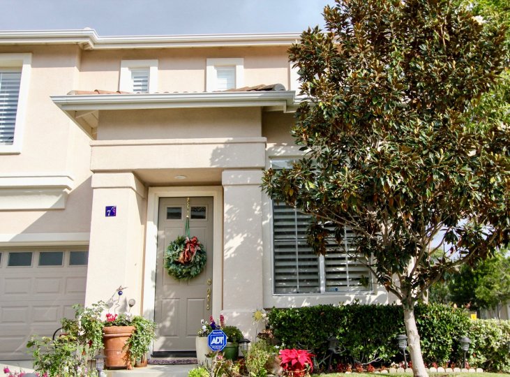 A wreath hangs from the front door of this Tivoli II home