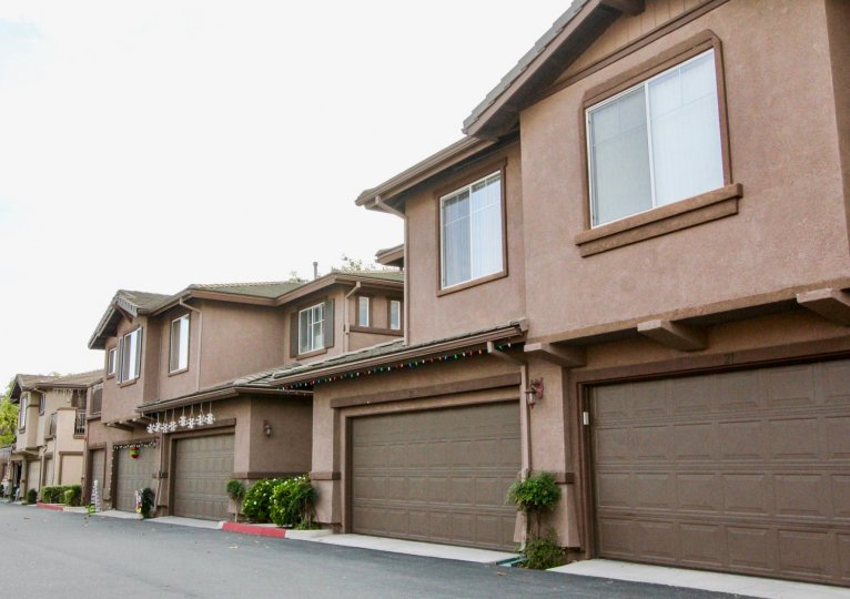 Cloudy sky with apartments and garages in the Vistas Above Wood Canyon Community in Aliso Vieja, CA.