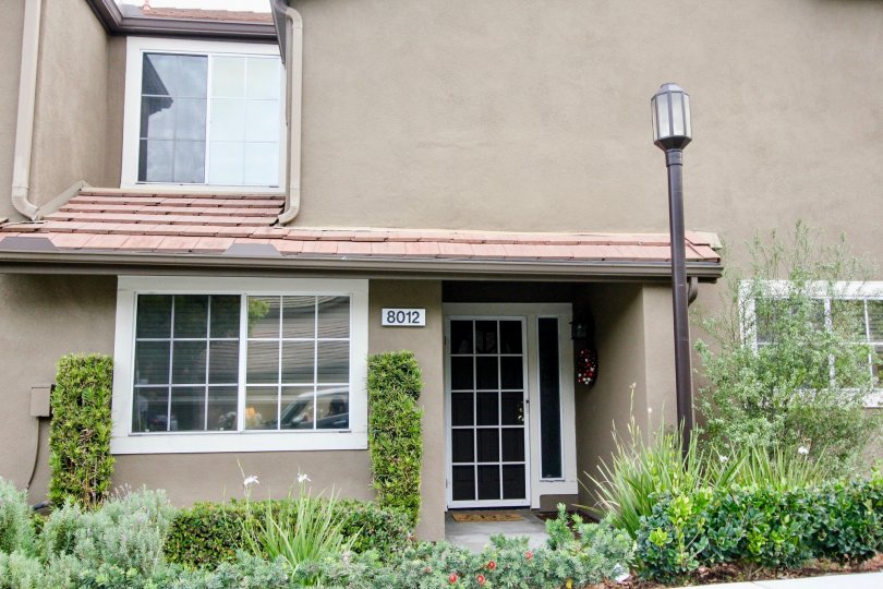 THIS HOME HAS THE NUMBER BOARD ON THE WALL, SHOWS THE NIGHT LAMP AND SO MANY PLANTS WITH FLOWERS ARE VIEWED IN THE CITY OF ANAHEIM HILLS