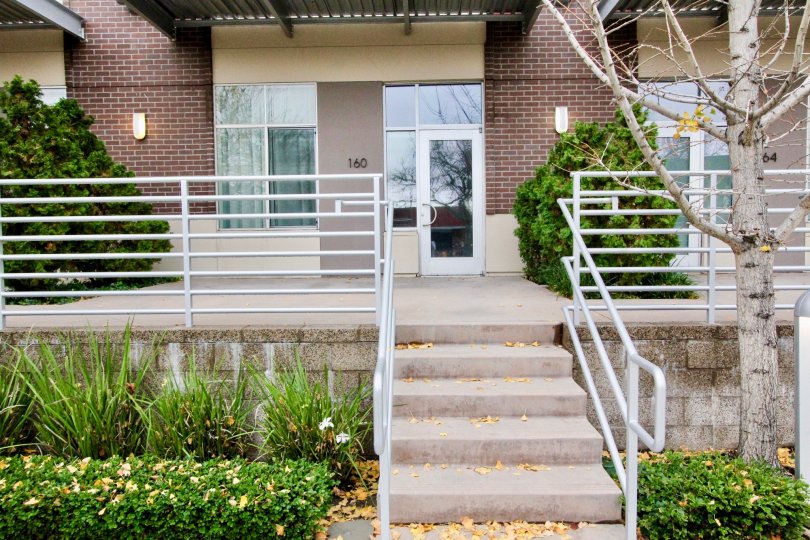 The front porch of a bunglow with steel railings at Harbor lofts