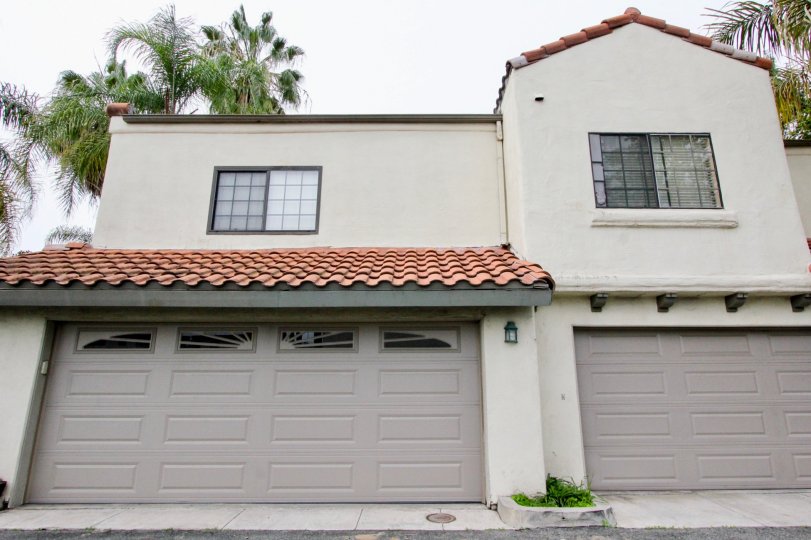 A medium house with glass windows in the Palm Villas.