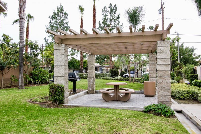 A day in the Park Place with a small shelter and chair.