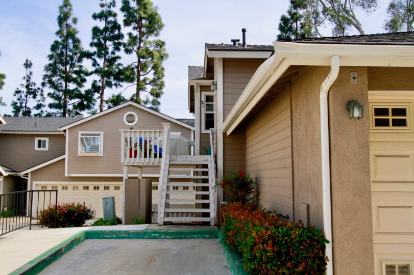 Canyon Walk homes with a staircase and balconies on a sunny day.
