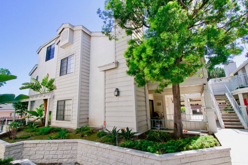 Nice view of Villa with green trees and staircase in Coral Point of Costa Mesa