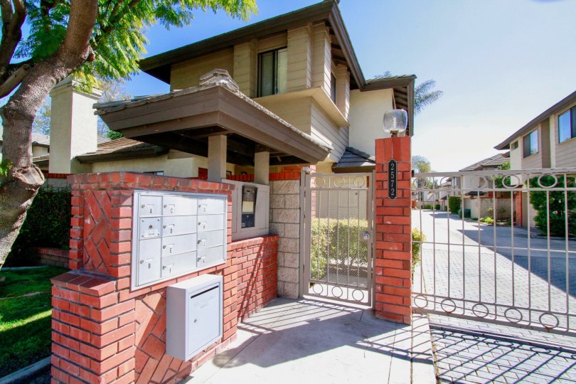 Front gate and mailboxes for homes of Elden Shadows in Costa Mesa California