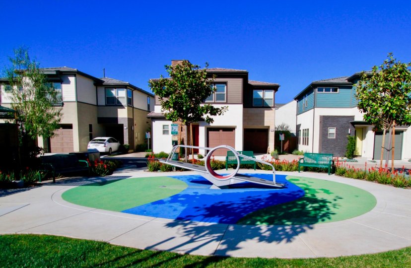 A sunny day at an ADA-accessable teeter-totter within the small park The Edge in Coasta Mesa, California.