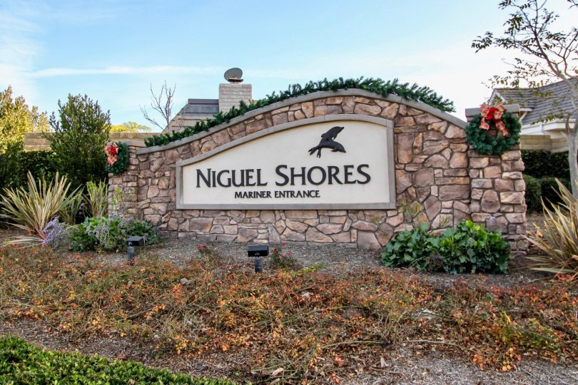 THE VILLAS IN THE NIGUEL SHORES WITH THE NIGUEL SHORES WALL, PLANTS, TREES