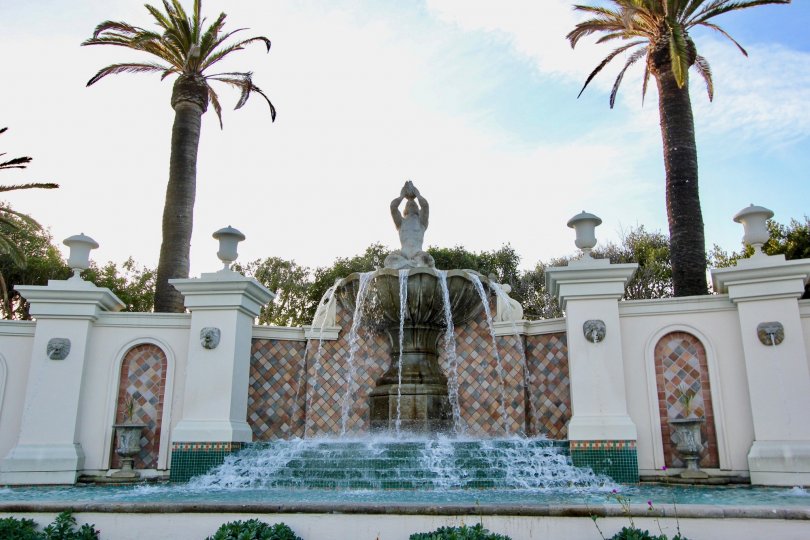 A sunny day in the Sea Villas at St. Regis with a sculpture on a water fountain.