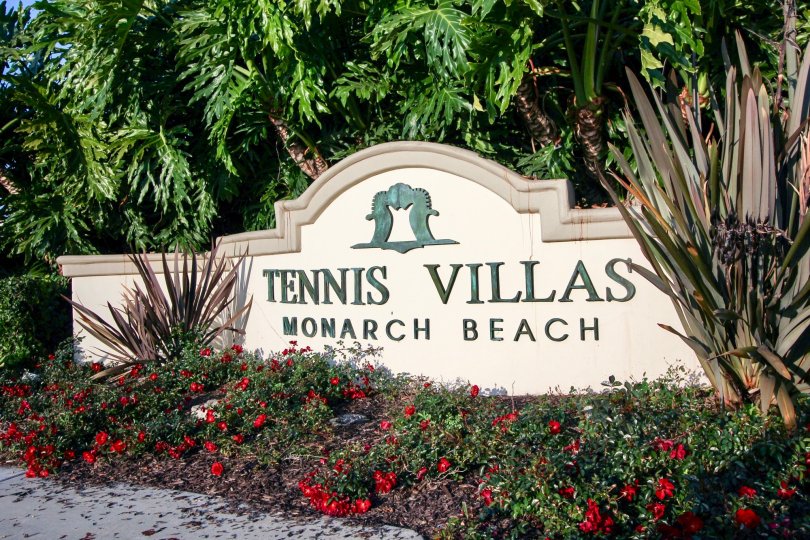 A noticeable community sign sits at the entrance of Tennis Villas in Dana Point California