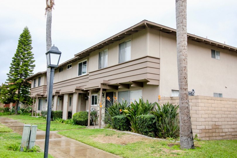 A rain soaked walkway leading to gorgeous townhomes inside the Fountain Plaza in Fountain Valley CA