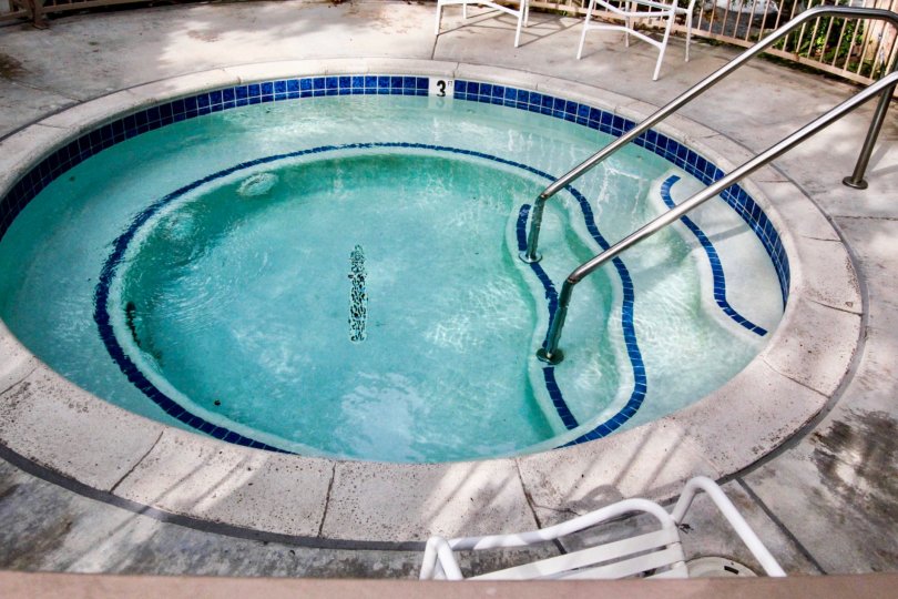 Swimming pool is placed for children which has less depth with seating chairs in Hidden lakes