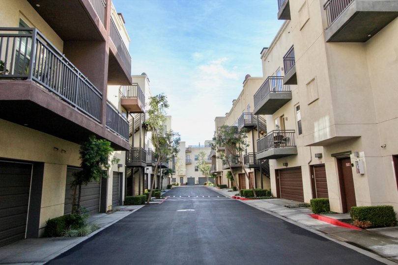 A multi level residential area with garages with more units across a small street located in the Soco Walk community.