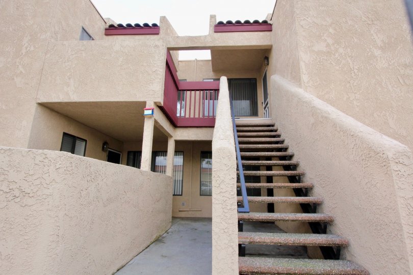stair in front of the pink color painted house in Garden Creek
