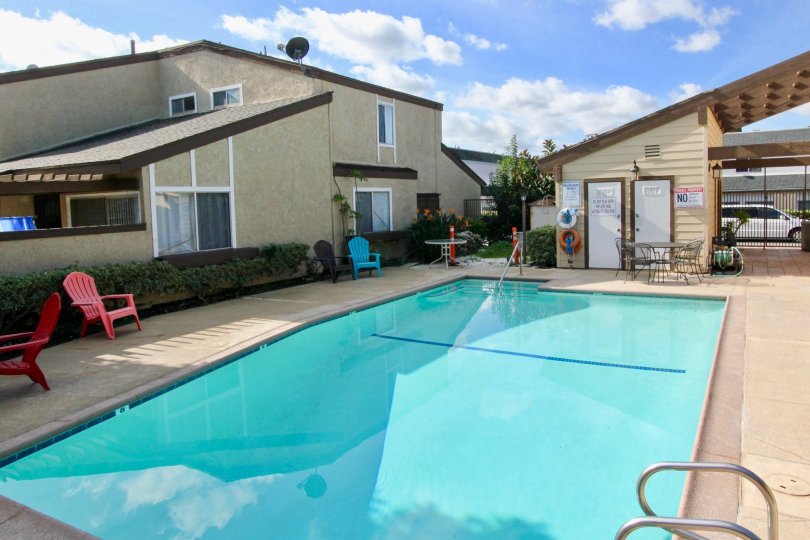 THE BUNGALOW IN THE GARDEN TERRACE TOWNHOMES WITH THE CAR PARKING, SWIMMING POOL, DINING TABLES, CHAIRS, PLANTS, DISH ANTENNA