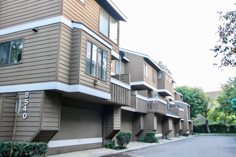 THE APARTMENT WITH TREES, PLANTS, NUMBER ON THE WALL WHICH IS LOCATED IN THE CITY OF GARDEN GROVE